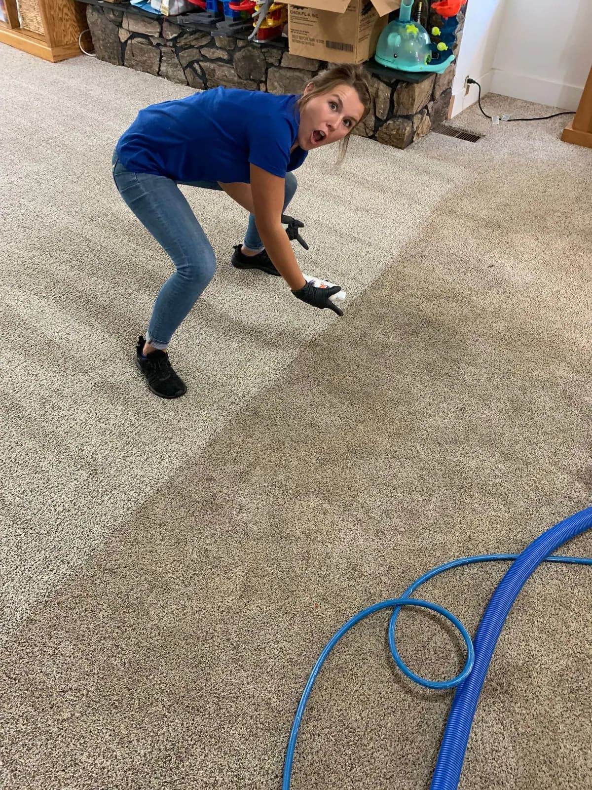 A Freedom Cleaning technician deep-cleaning a carpet