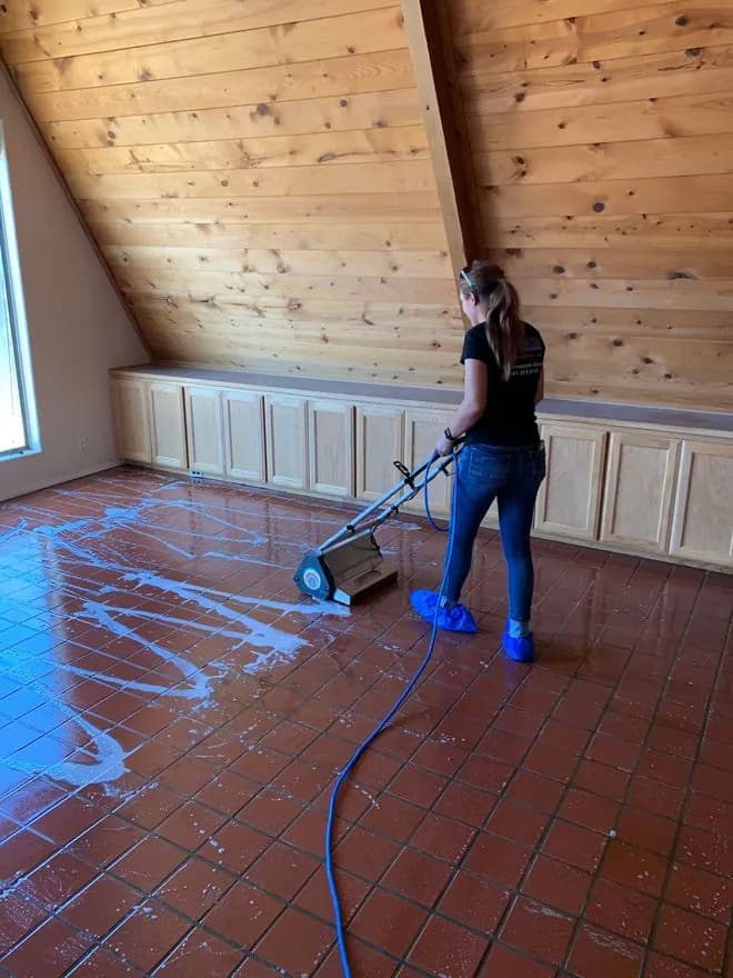 Tile floor being cleaned
